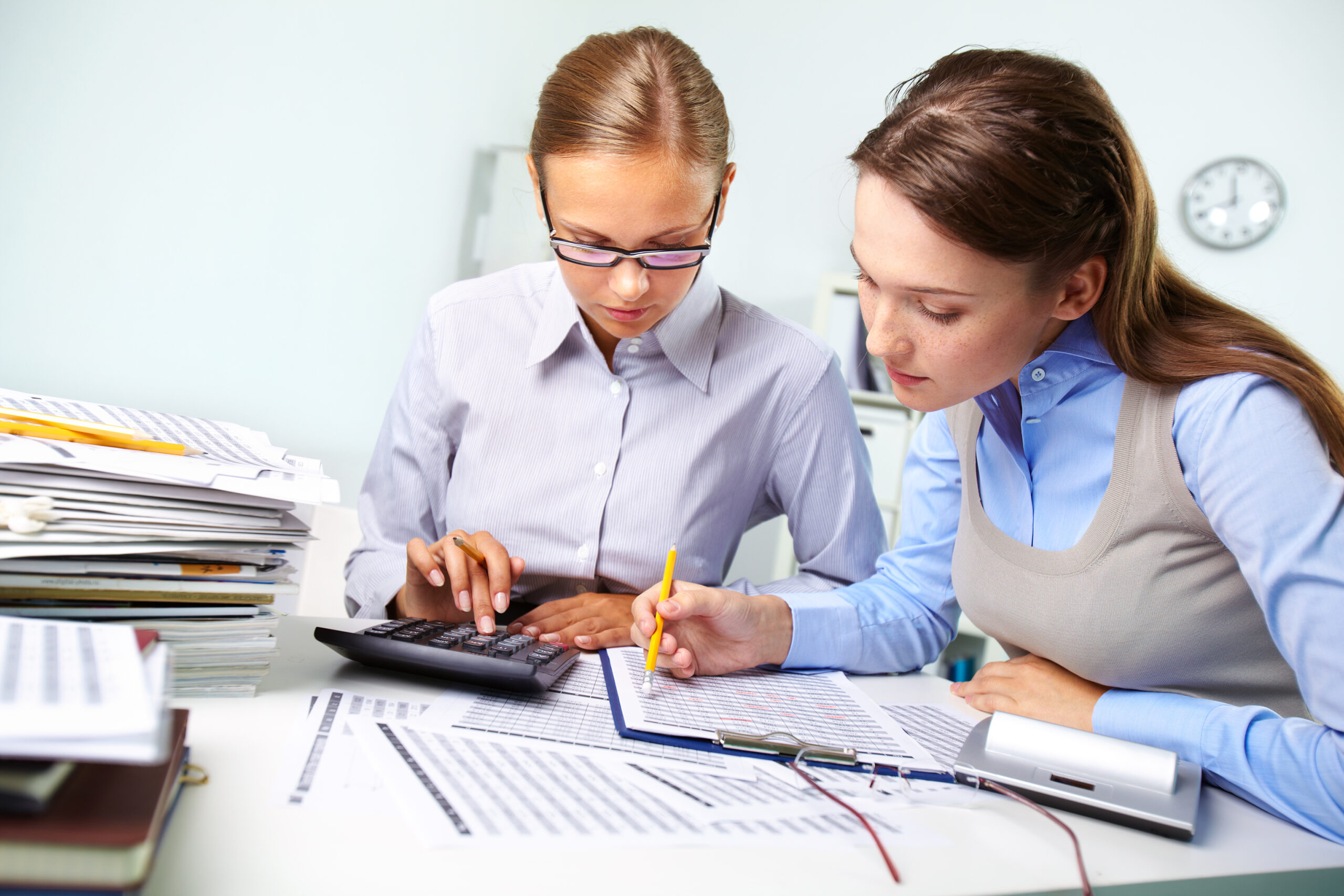 Accounting report Concentrated business women reviewing accounting report